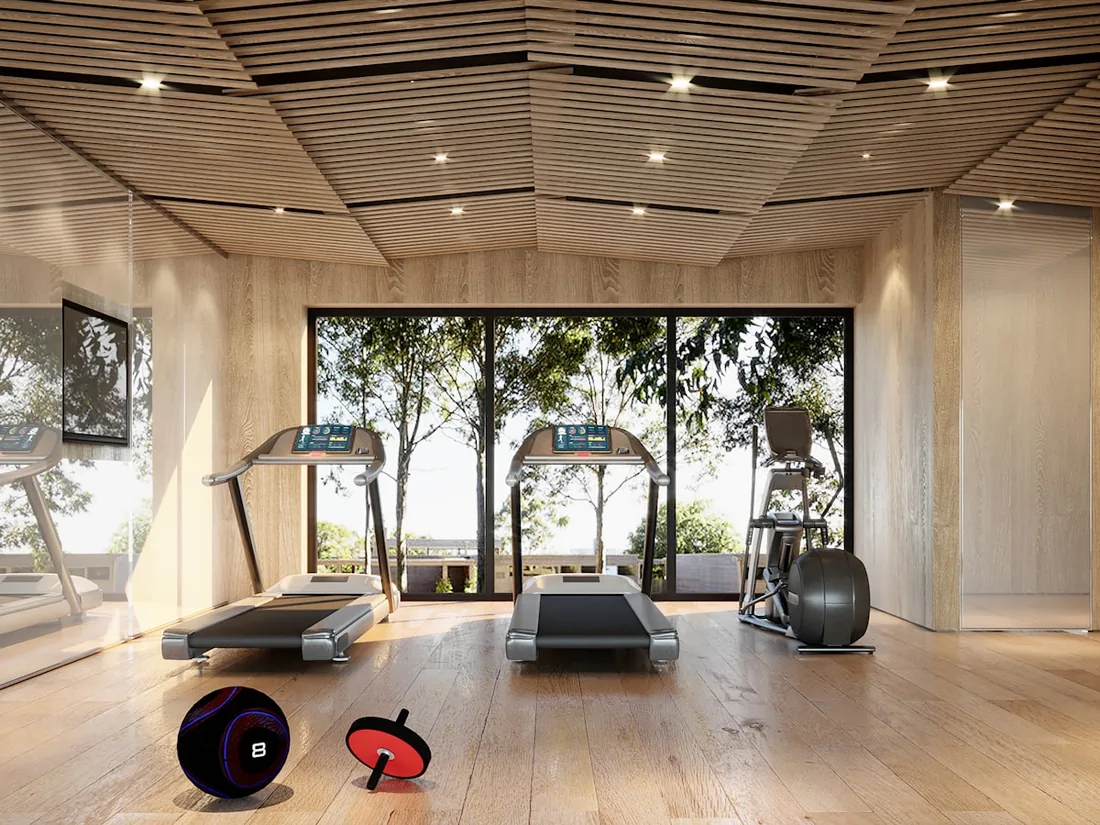 Modern community fitness room with treadmills and large windows
